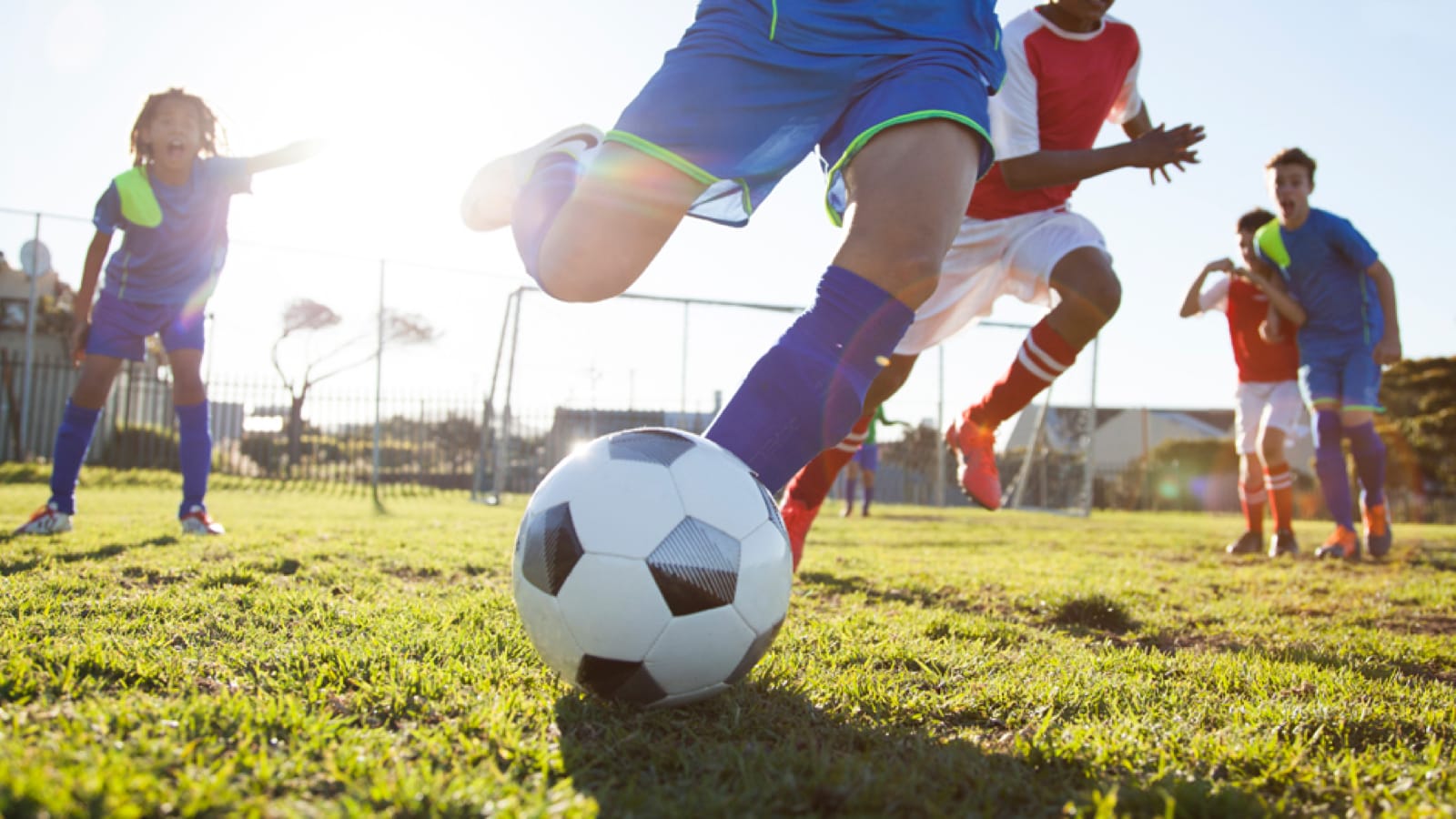 Child kicking a soccer ball